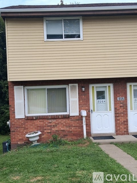 A house with the number 8064 on the front door.
