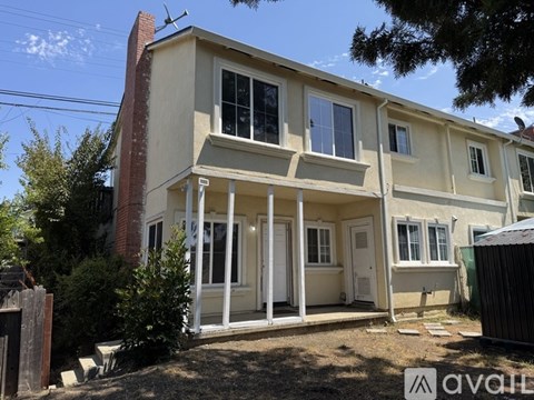 A two-story house with a white front porch.