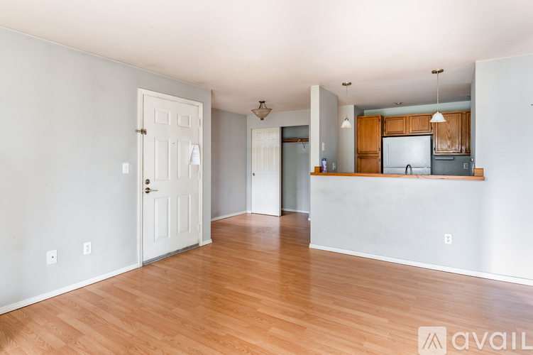 A room with wooden floors and white walls.