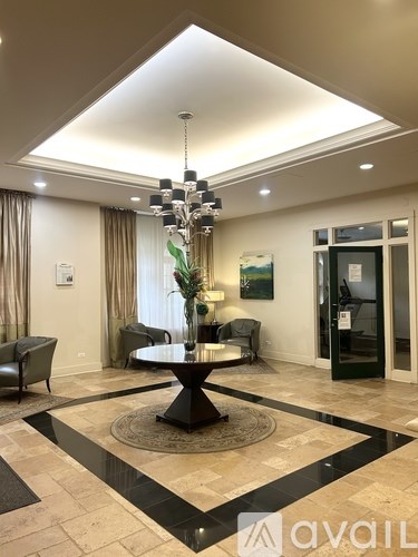 A modern living room with a large table and chairs.