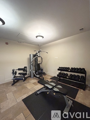 A well-equipped home gym with a variety of exercise equipment.