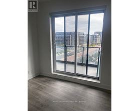 A large window with a view of a cityscape and buildings outside.