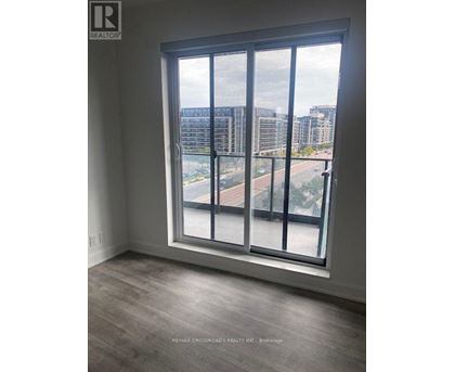 A large window with a view of a cityscape and buildings outside.