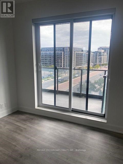 A large window with a view of a cityscape and buildings outside.