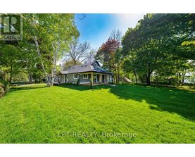A house with a lawn in front of it.