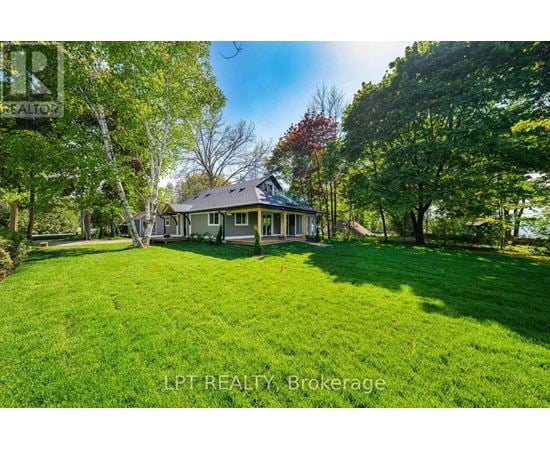 A house with a lawn in front of it.