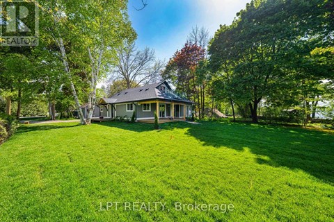A house with a lawn in front of it.