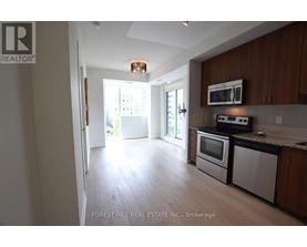 A kitchen with a microwave, oven, and dishwasher.