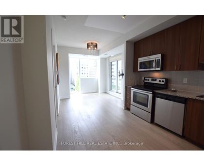 A kitchen with a microwave, oven, and dishwasher.