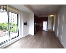 A spacious living room with a view of the city.