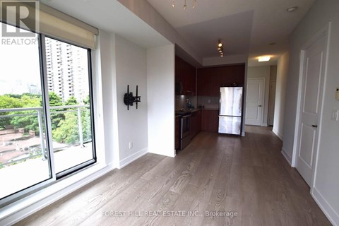 A spacious living room with a view of the city.
