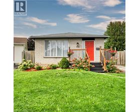 A house with a red door and a red front step.