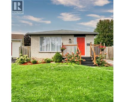 A house with a red door and a red front step.