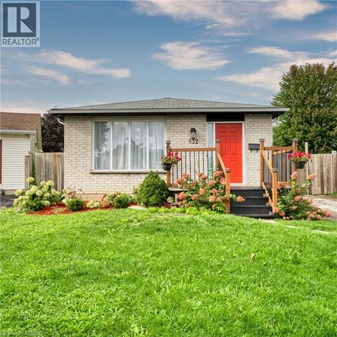 A house with a red door and a red front step.