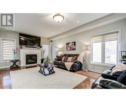 A living room with a fireplace and a couch.