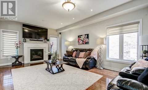 A living room with a fireplace and a couch.