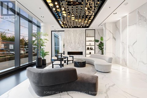 A modern living room with a grey sofa and a marble floor.