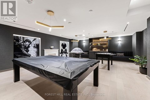 A bedroom with a large bed and a couch.