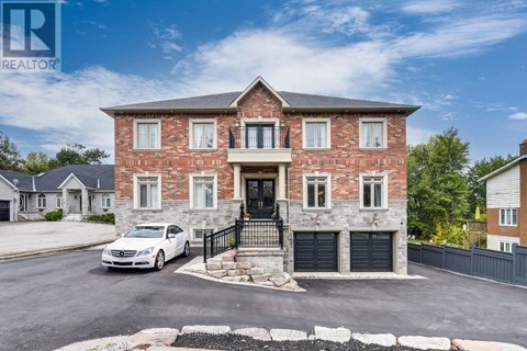 A house with a car parked in front of it.