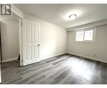 A room with a white door and a window with a white frame.