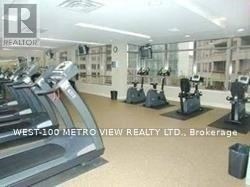 A gym with treadmills and elliptical machines.