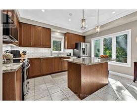 A modern kitchen with wooden cabinets and a central island.