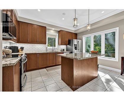 A modern kitchen with wooden cabinets and a central island.