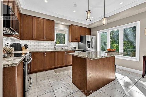 A modern kitchen with wooden cabinets and a central island.