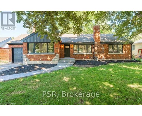 A house with the text PSR, Brokerage on the front yard.