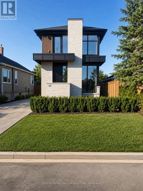 A modern house with a glass window is numbered 43.