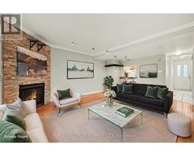 A living room with a fireplace and a couch.