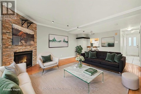 A living room with a fireplace and a couch.