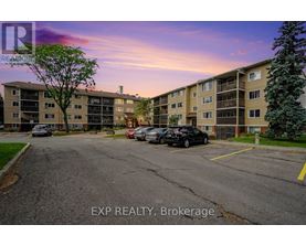 A parking lot in front of a building with the text EXP REALTY, Brokerage.