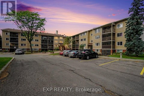 A parking lot in front of a building with the text EXP REALTY, Brokerage.