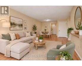 A well-lit living room with a couch, chair, and coffee table.