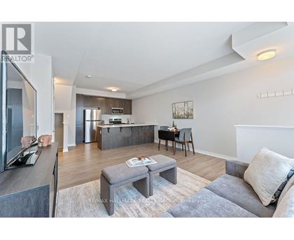 A modern living room with a grey sofa and a grey coffee table.