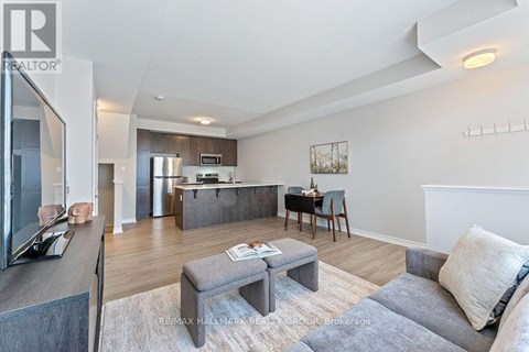 A modern living room with a grey sofa and a grey coffee table.
