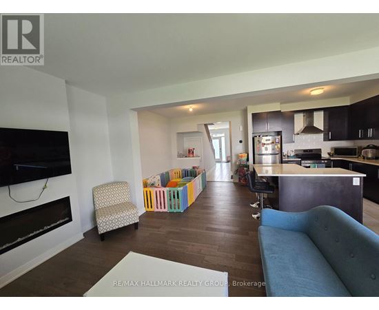 A living room with a blue couch and a television.