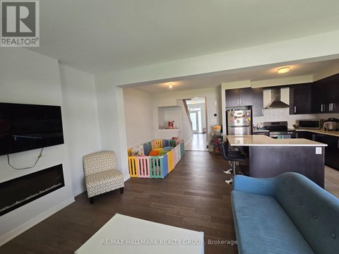 A living room with a blue couch and a television.