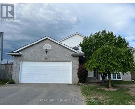 A house with a white garage door is for sale.