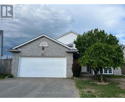 A house with a white garage door is for sale.