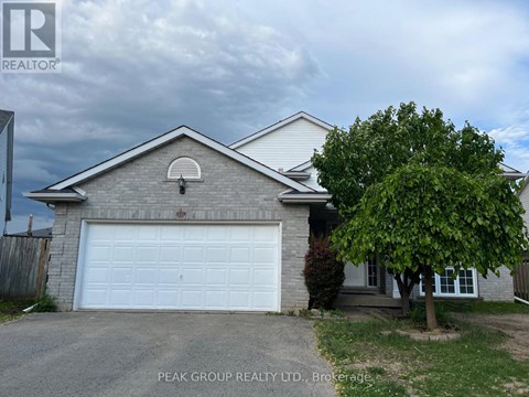 A house with a white garage door is for sale.