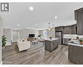 A modern kitchen with wooden cabinets and a white island.