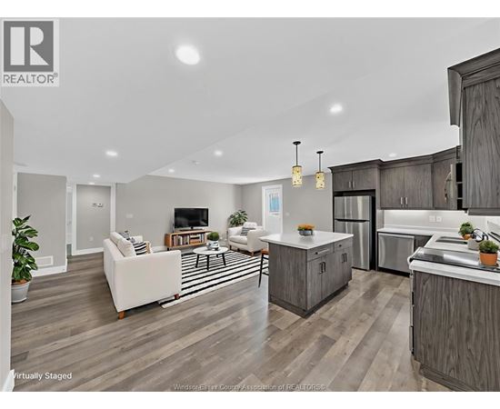 A modern kitchen with wooden cabinets and a white island.