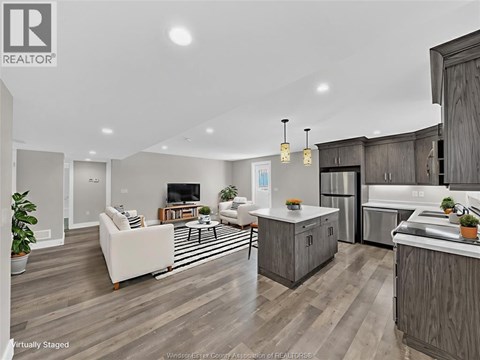 A modern kitchen with wooden cabinets and a white island.