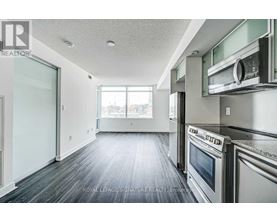 A kitchen with a stainless steel oven and microwave.