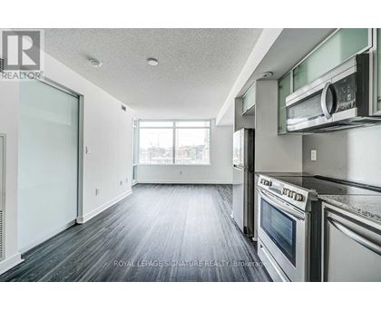 A kitchen with a stainless steel oven and microwave.