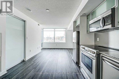 A kitchen with a stainless steel oven and microwave.