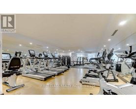 A gym with treadmills and exercise bikes.