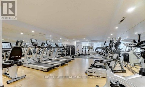 A gym with treadmills and exercise bikes.
